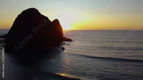 The beautiful sunset at Piha Beach in New Zealand in HD photo