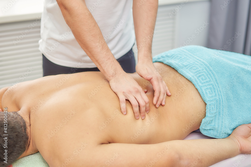 Recovery massage of an athlete after competitions, training. Professional sports massage. Recovery massage of an athlete after competitions, training. Professional sports massage.