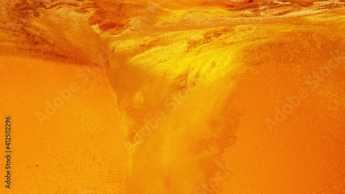Detail of pouring beer creating twister shape