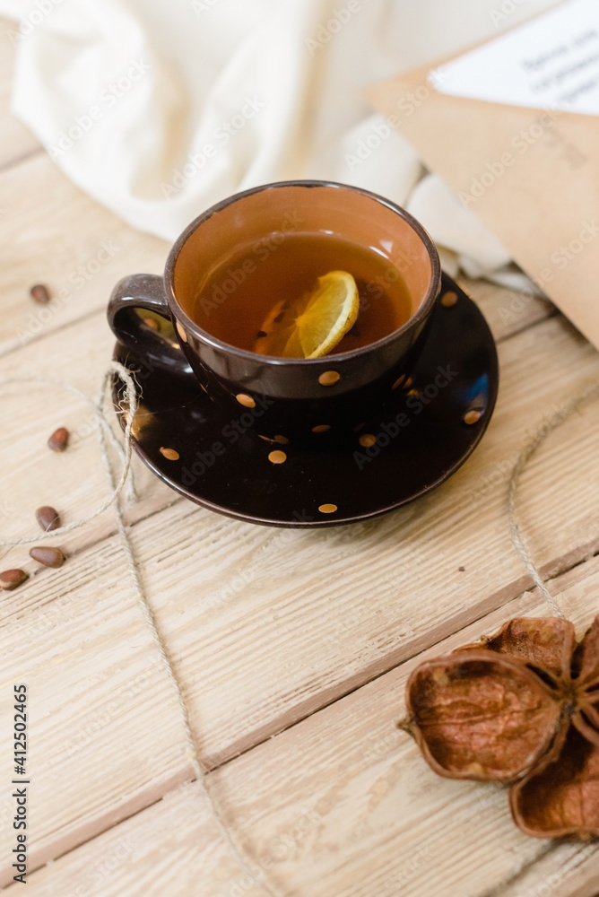 Lifestyle, cozy mug of lemon and spice tea. Soft blurred focus. Perfect background. Lifestyle, cozy mug of lemon and spice tea. Soft blurred focus. Perfect background.