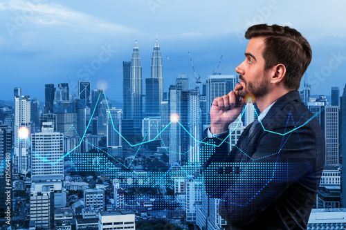 Canvas Print Caucasian handsome businessman in suit pondering about new approaches to consultancy to find priorities for venture capital start up to estimate prospective growth