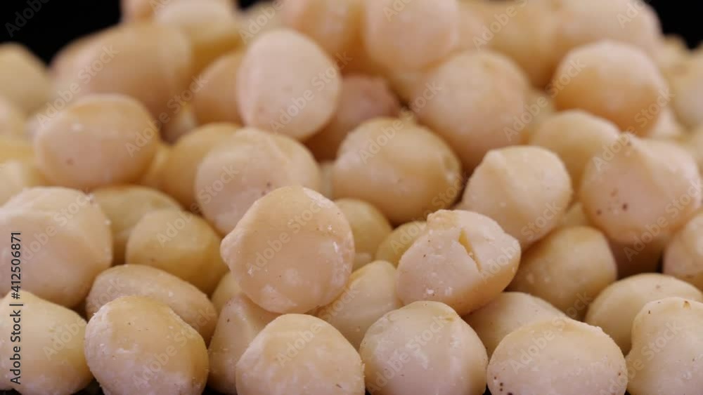 Macadamia nuts rotating close up. Macadamia, organic and ecological nuts isolated. Macadamia nuts rotating close up. Macadamia, organic and ecological nuts isolated.