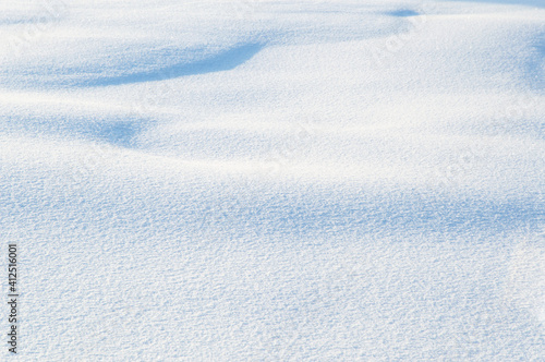winter landscape: loose shiny snow, drifts and snow dunes