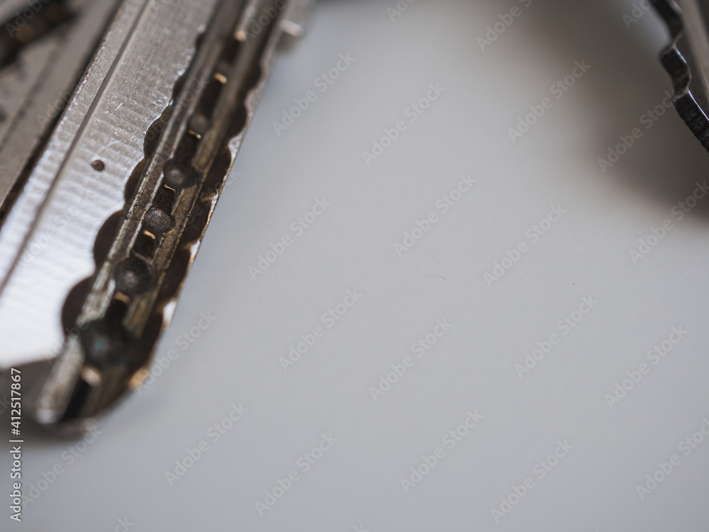 House keys close up with white background Macro details House keys close up with white background Macro details