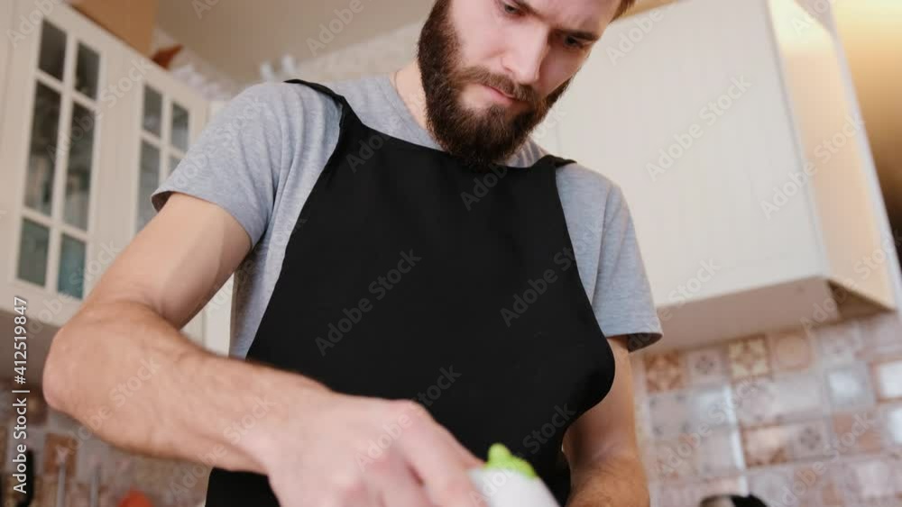A chef beats eggs with a mixer in a modern kitchen. Preparing ingredients for baking sweet muffins or cake. Cooking desserts. A chef beats eggs with a mixer in a modern kitchen. Preparing ingredients for baking sweet muffins or cake. Cooking desserts.