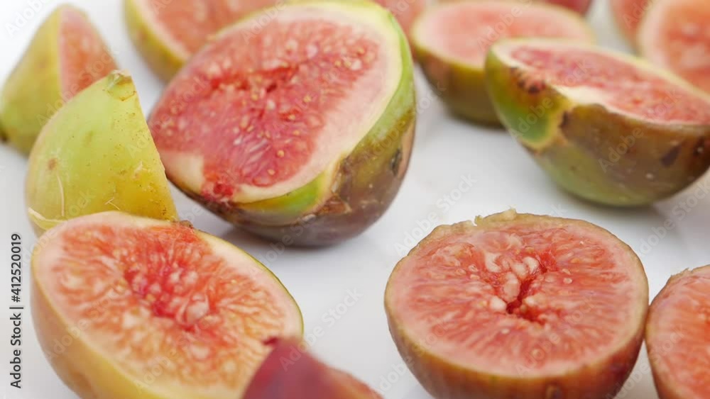 Juicy fruits close view, Rotating shot of figs isolated over white background Juicy fruits close view, Rotating shot of figs isolated over white background