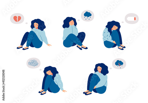 Female child or adolescent who suffers from mental health diseases is sitting on the floor with sad thoughts. Girl surrounded by symptoms of depression disorder: anxiety, crisis, tears, exhaustion, lo