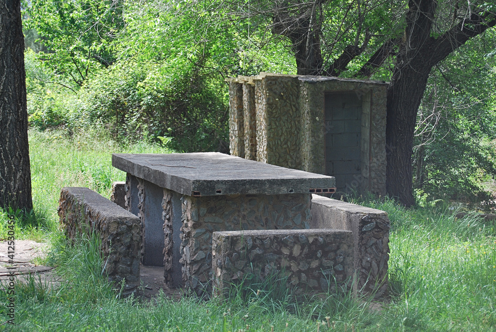 Stone picnic table and seating architecture in the countryside Stone picnic table and seating architecture in the countryside