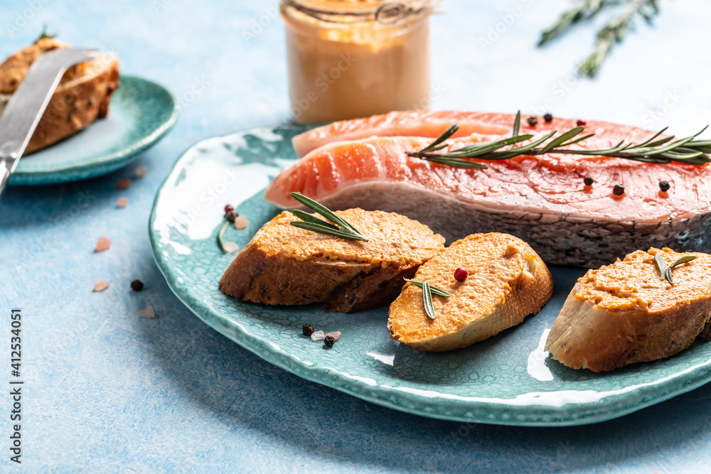 Appetizer with salmon mousse. Toast with soft cheese spread, mousse
