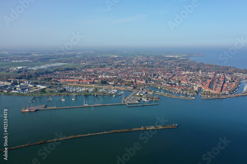 Aerial drone photo of the beautiful historic city of Enkhuizen, with old town marina harbors in the Netherlands