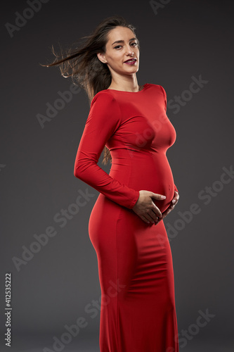 Gorgeous pregnant lady in red dress