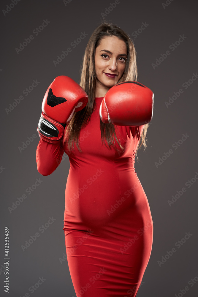 Pregnant lady with boxing gloves Pregnant lady with boxing gloves