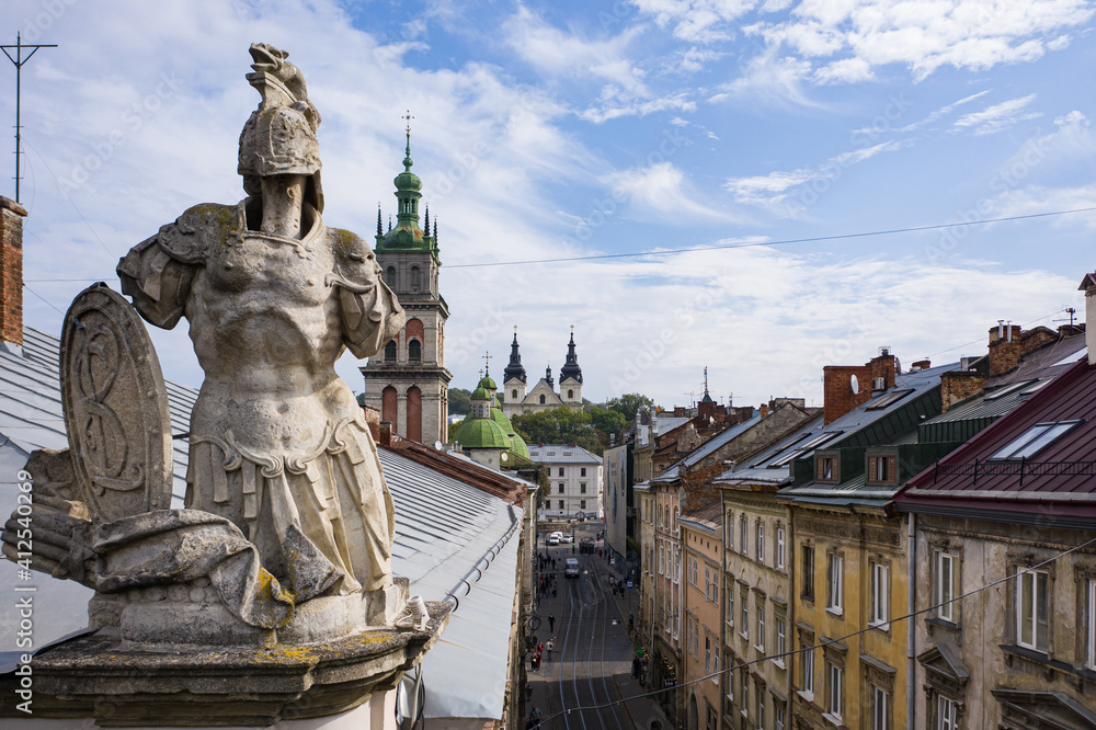 Aerial view on Market square in Lviv, Ukraine from drone. Sculpture of knight