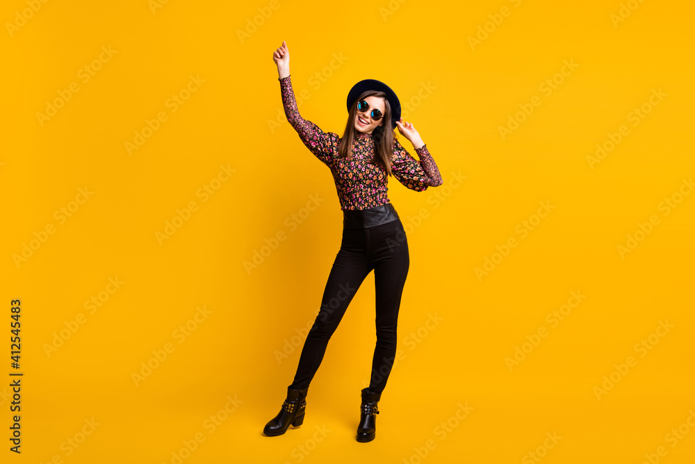 Full length body size photo of pretty brunette dancing wearing stylish clothes isolated vivid yellow color background