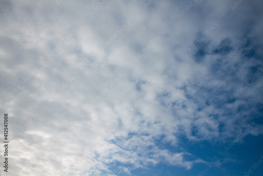 White-gray clouds and a little blue sky. Background