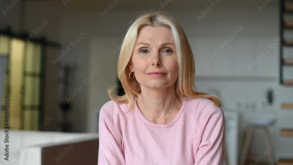 Video chat, online video meeting with a charming elegant mature middle-aged businesswoman. The view while the video-calling concept Video chat, online video meeting with a charming elegant mature middle-aged businesswoman. The view while the video-calling concept