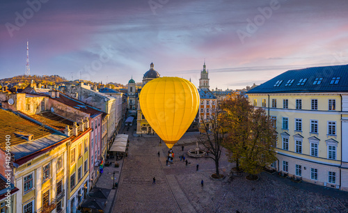 Yellow Hot Air Balloon on Market square in Lviv, Ukraine. View from drone © Ruslan