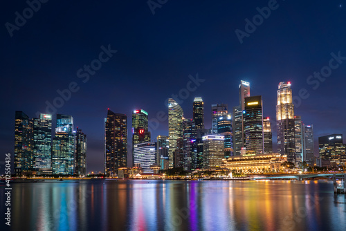 Wide panorama of Singapore cityscape at magic hour. © hit1912