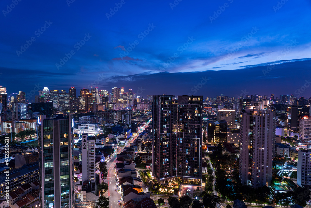 Wide panorama of Singapore cityscape at magic hour.