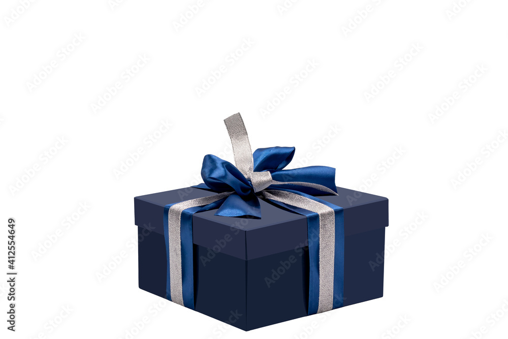Blue gift box, tied with a silver-blue ribbon with a bow, isolated on a white background. Blue gift box, tied with a silver-blue ribbon with a bow, isolated on a white background.