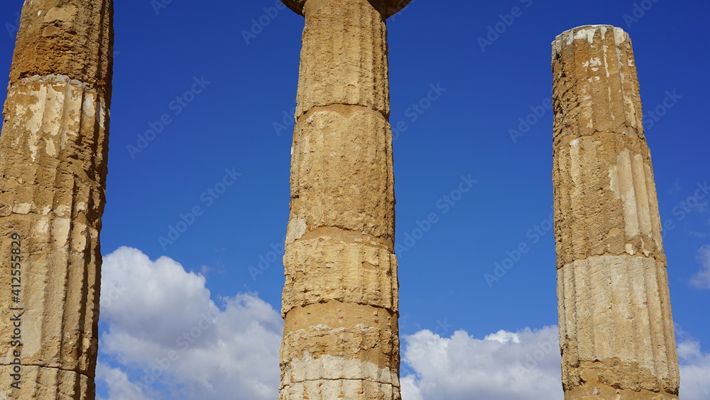 Isolated columns on blue sky of Greek Temple ruins. Valley of Temples, Agrigento, Italy