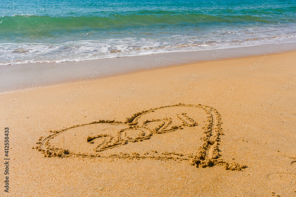 2021 year and love heart sign hand written sandy beach outdoors seascape background. 2021 year and love heart sign hand written sandy beach outdoors seascape background.