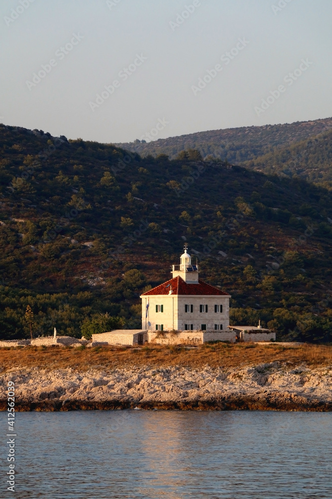 Picturesque lighthouse on small island near Hvar, Croatia.