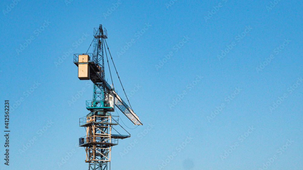 Construction site with cranes on sky background Construction site with cranes on sky background