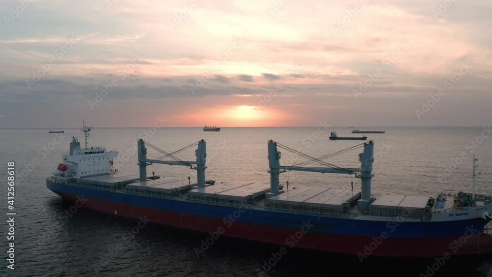 A drone flight around container ships into the sea at sunrise, the Black Sea, Bulgaria A drone flight around container ships into the sea at sunrise, the Black Sea, Bulgaria