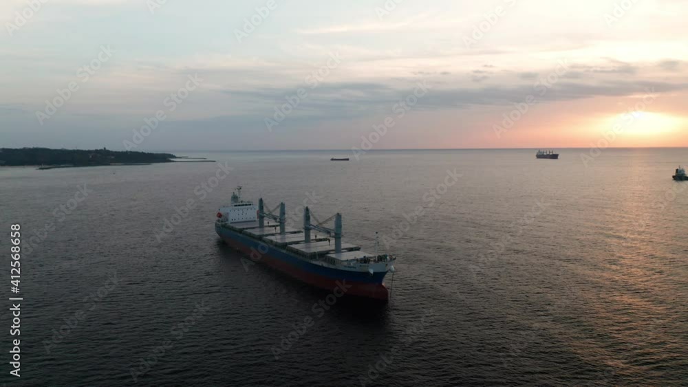 A drone flight around container ships into the sea at sunrise, the Black Sea, Bulgaria A drone flight around container ships into the sea at sunrise, the Black Sea, Bulgaria