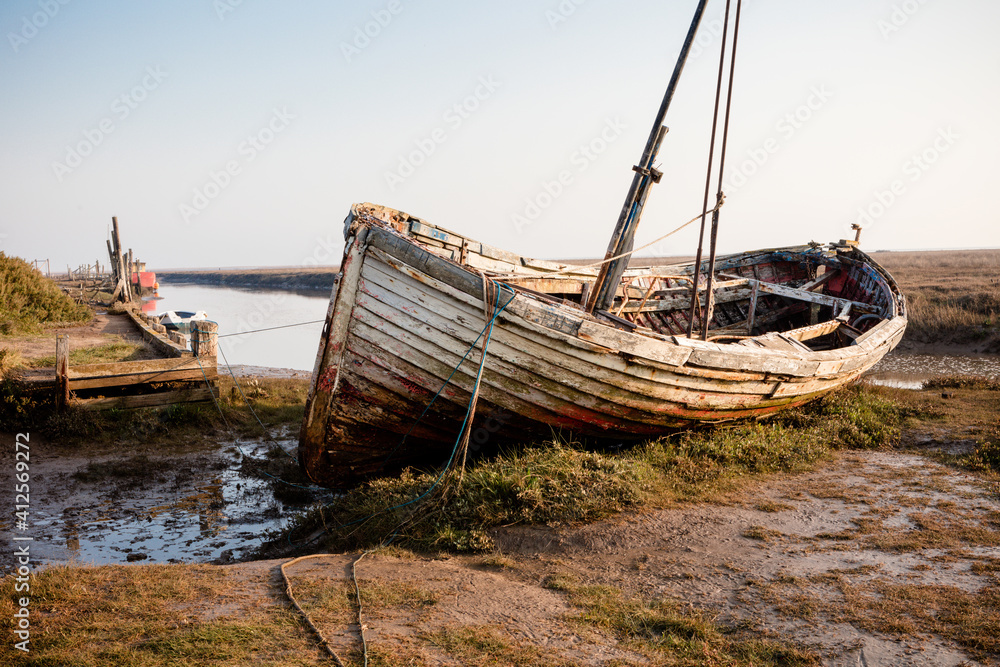 Old boat at Thornham old harbour, Norfolk, England Old boat at Thornham old harbour, Norfolk, England