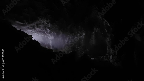 Blockage of stones at exit from cave. Stream of light and steam.
