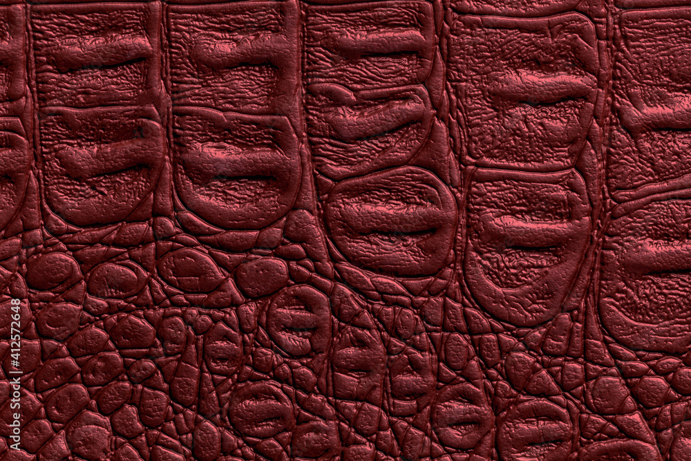 Dark red leather texture background, closeup. Wine reptile skin fabric, macro. Dark red leather texture background, closeup. Wine reptile skin fabric, macro.