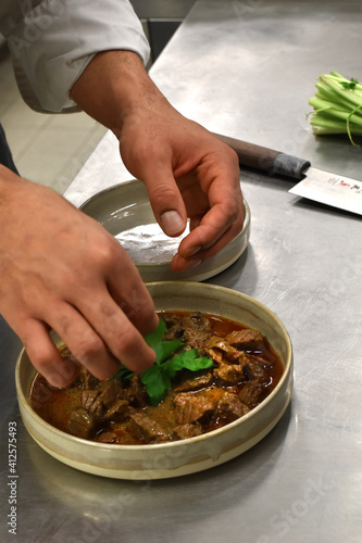 Chef garnishing food