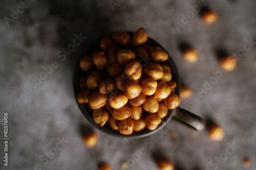 Roasted Chickpeas on dark moody background, selective focus