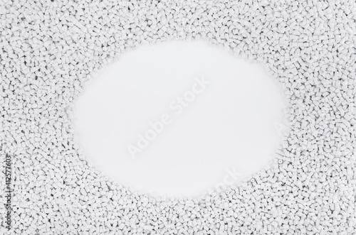 Polymer products of grey and white colour. Polymers lie on a white background forming an oval and circle area for an inscription or signature with an announcement. Polymers and polystyrene. 