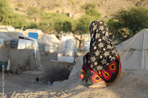 A Yemeni girl lives with her family in a camp for displaced people fleeing the hell of war 