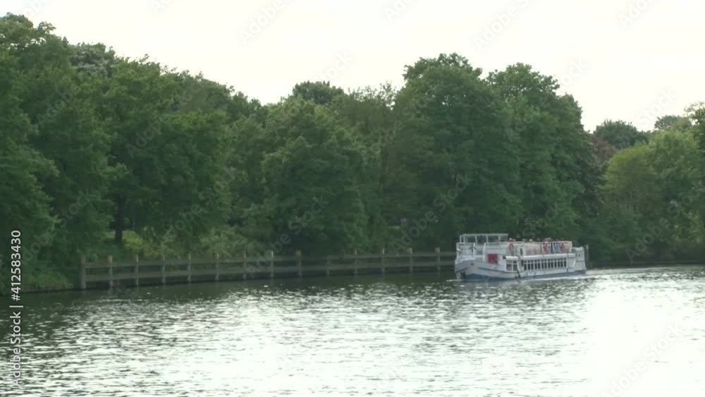 Tourist, excursion boats on the Spree river in Berlin. Tourists spit near the attractions of Berlin Tourist, excursion boats on the Spree river in Berlin. Tourists spit near the attractions of Berlin
