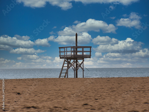 a sandy beach and the Adriatic Sea near Ulcinj (Montenegro) with a wooden tower for lifeguards