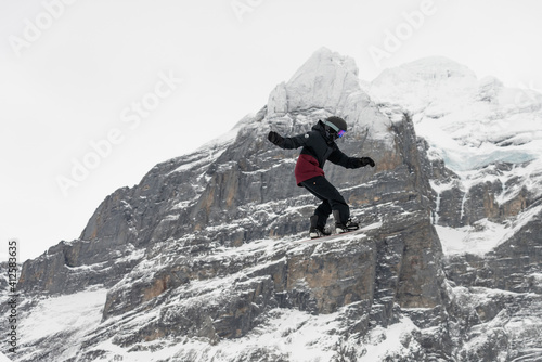 Snowboard ski freestyle big air contest in the background Mittelhorn mountain. Snowboard tricks, ski tricks. Jungfrau region Switzerland