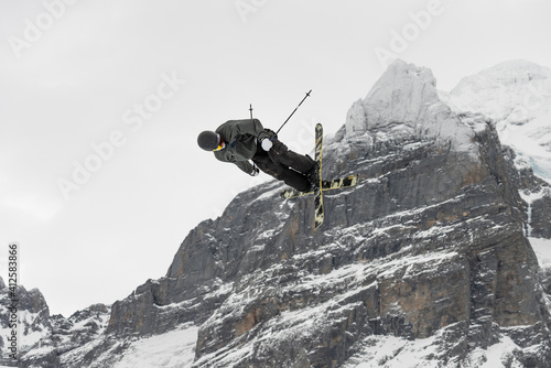 Snowboard ski freestyle big air contest in the background Mittelhorn mountain. Snowboard tricks, ski tricks. Jungfrau region Switzerland photo