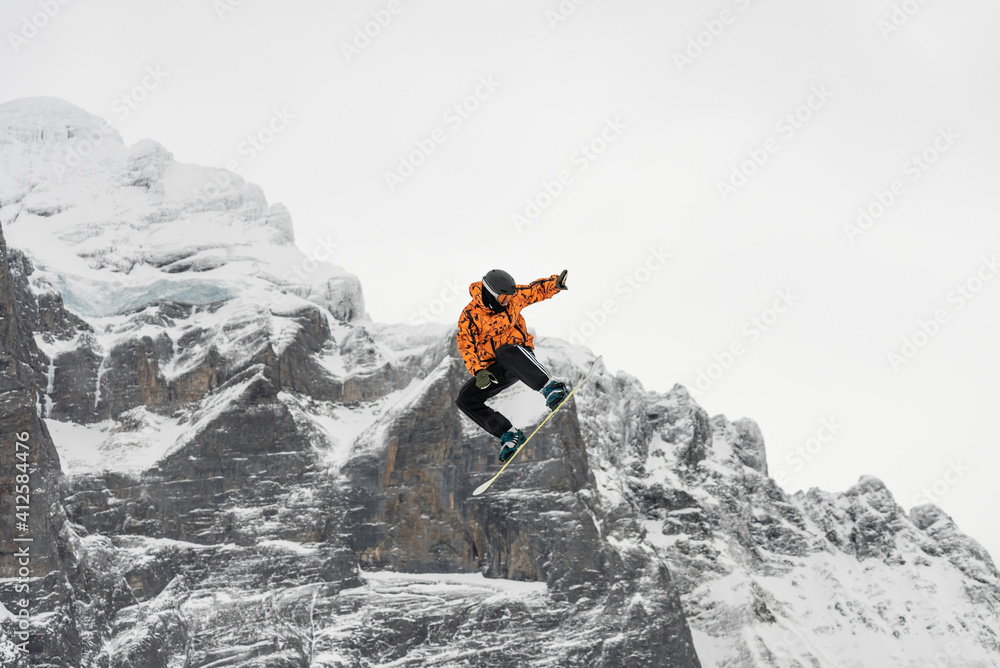 Snowboard ski freestyle big air contest in the background Mittelhorn mountain. Snowboard tricks, ski tricks. Jungfrau region Switzerland