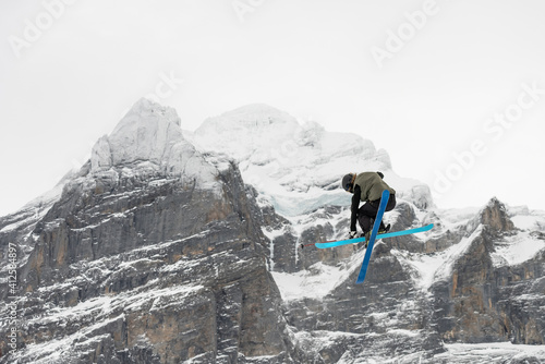 Snowboard ski freestyle big air contest in the background Mittelhorn mountain. Snowboard tricks, ski tricks. Jungfrau region Switzerland photo