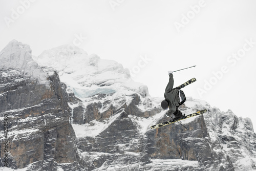 Snowboard ski freestyle big air contest in the background Mittelhorn mountain. Snowboard tricks, ski tricks. Jungfrau region Switzerland photo