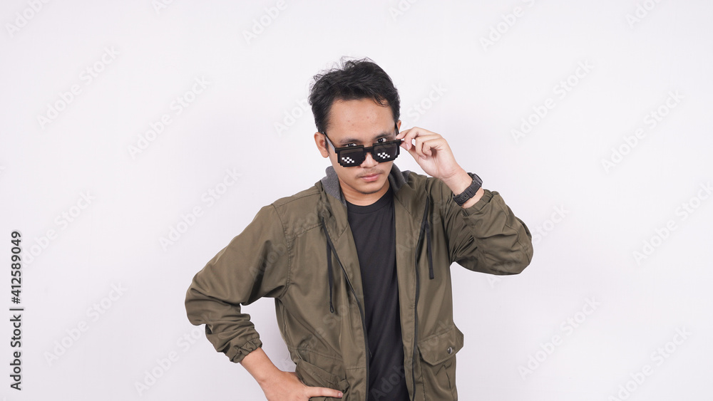 The young man wearing glasses on a white background The young man wearing glasses on a white background