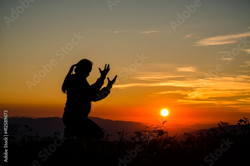 Woman praying in the morning.