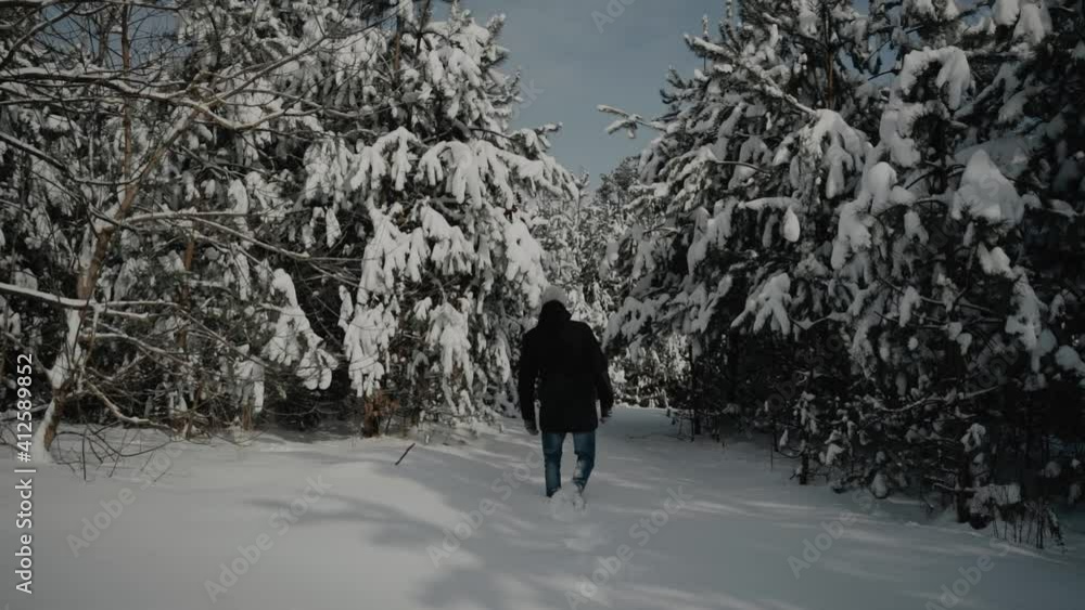 Happy young man walking in winter pine forest. Snowy weather. Wanderlust, inspiration and travel concept. A lot of snow on trees. 4k video. Slow motion.
Happy young man walking in winter pine forest. Snowy weather. Wanderlust, inspiration and travel concept. A lot of snow on trees. 4k video. Slow motion.
