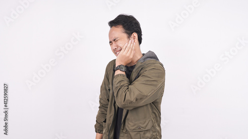 Asian man toothache on a white background