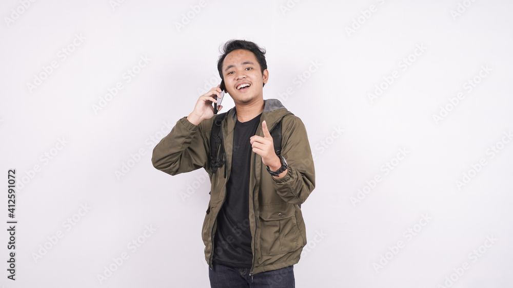 Asian man called out pointing on a white background Asian man called out pointing on a white background
