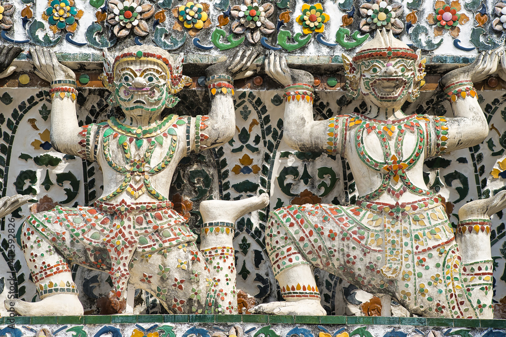 thai art sculpture and giant warriors at Wat Arun temple